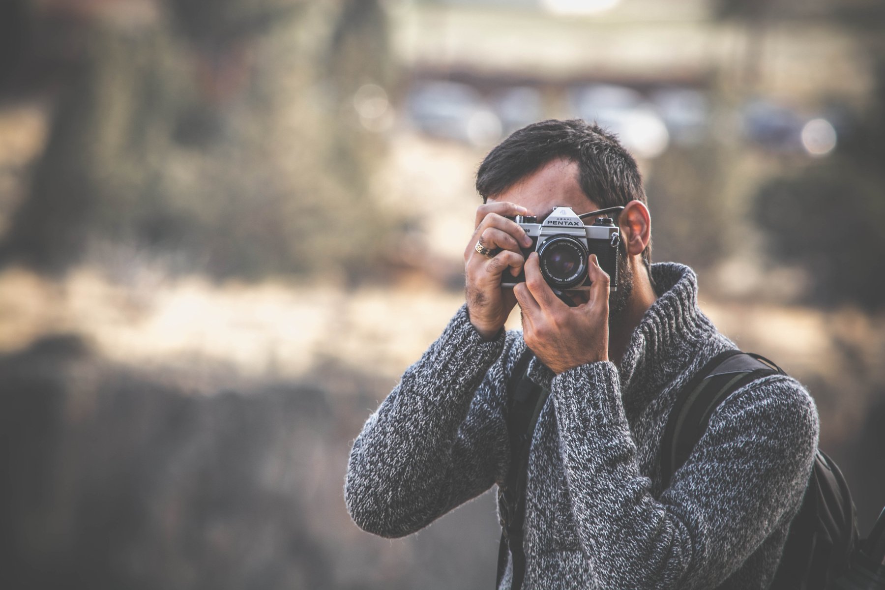 Focus Photo of Man Taking Photo